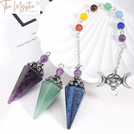 A shimmering cone-shaped pendant crafted from natural stone crystals represents the 7 Chakras.