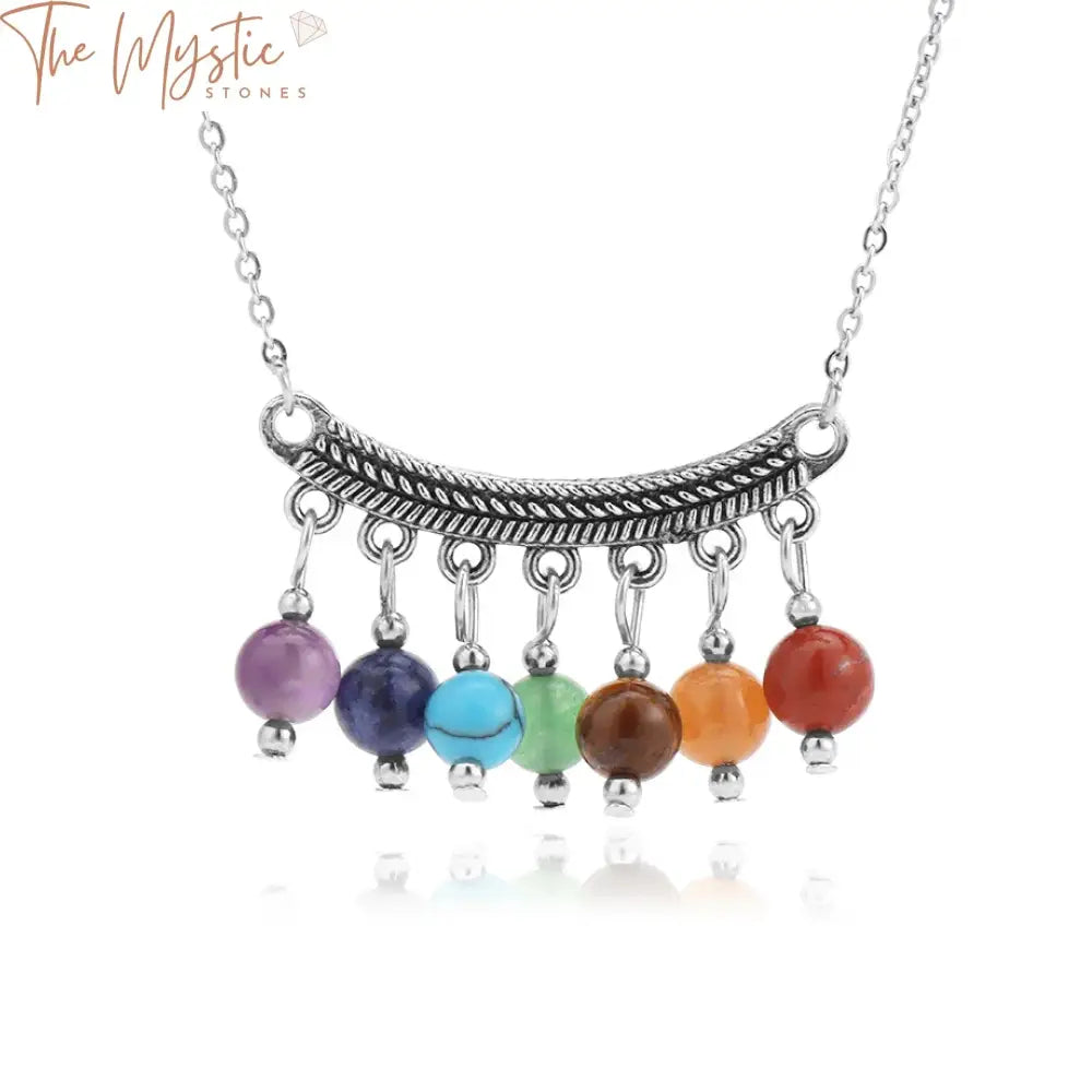 A vibrant and colorful necklace featuring a series of polished natural stone beads representing the 7 chakras.