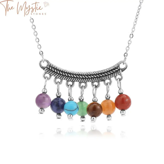 A vibrant and colorful necklace featuring a series of polished natural stone beads representing the 7 chakras.