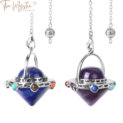 A 7 Chakra Crystal Pendulum featuring a unique alien spaceship pendant design.