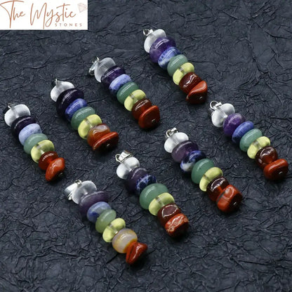 A vibrant pendant featuring an array of colorful crystal gravel, each representing the seven chakras.