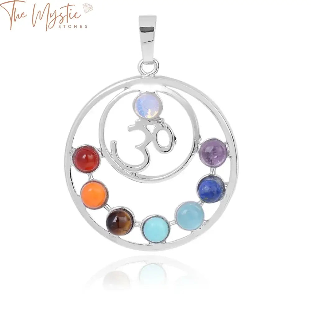 A collection of seven polished gemstone pendants, each representing one of the seven chakras.