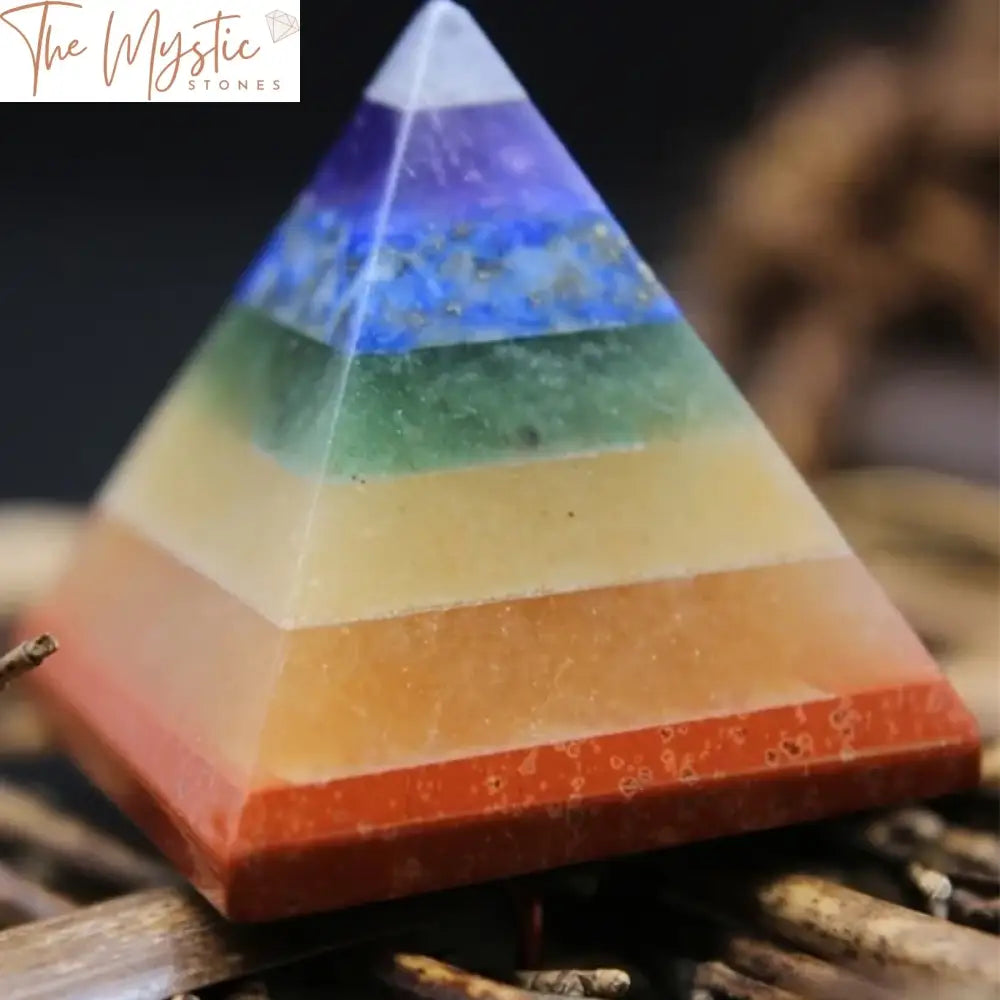 A pyramid-shaped structure made of multi-colored stones, each representing one of the 7 chakras.