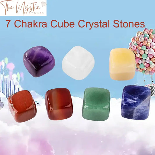 A set of seven polished, cube-shaped gemstones, each representing a different chakra.