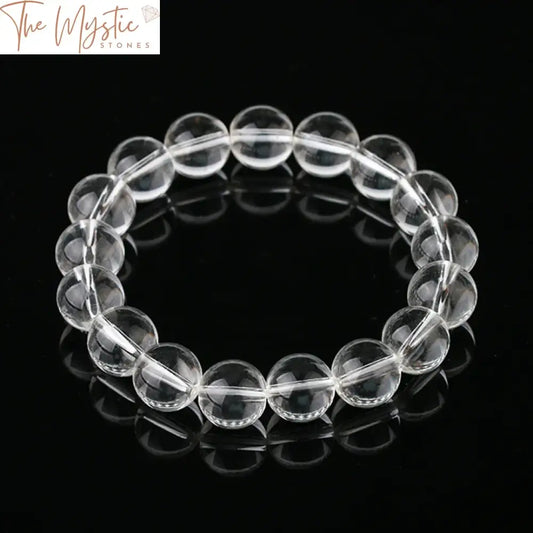 A bracelet made of 12mm natural gemstone beads featuring white clear quartz rock crystals.