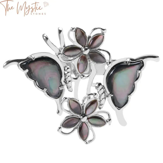 A close-up image of a butterfly-shaped brooch featuring intricate detailing.