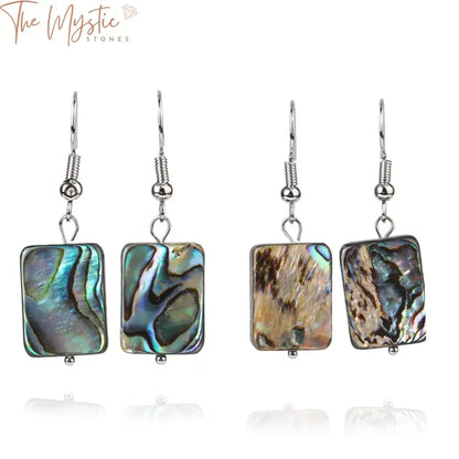 Pair of dangle hook earrings featuring vibrant, iridescent abalone shell pendants.