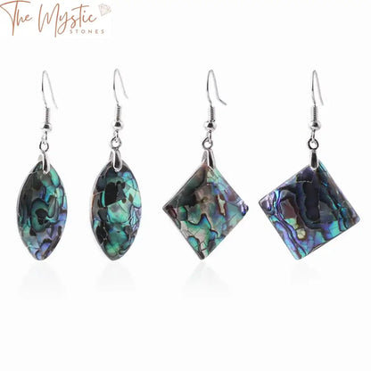 A pair of geometric dangle earrings featuring natural abalone shell designs.