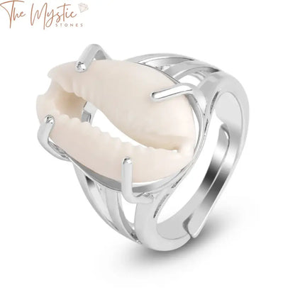 A stylish, adjustable silver-colored ring with a natural white conch seashell at its center, designed for both men and women.