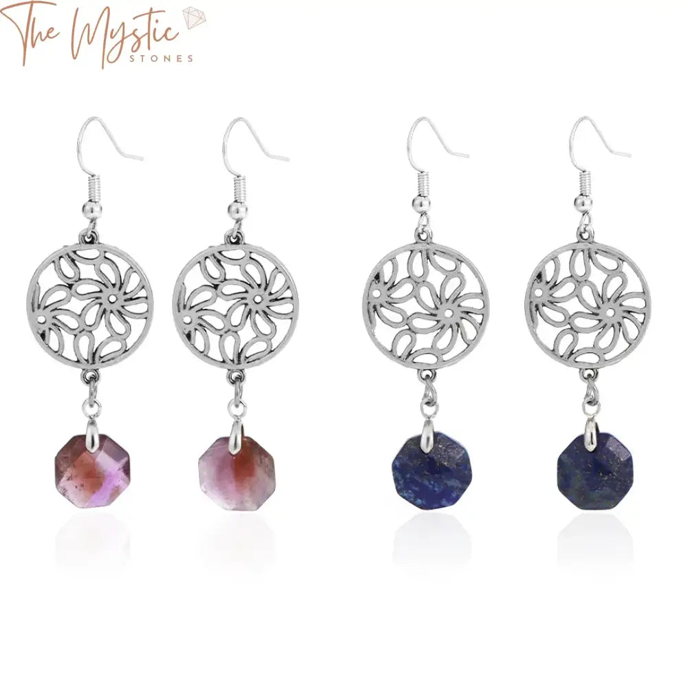 A pair of drop earrings featuring faceted amethyst stones and pink crystal flower charms.