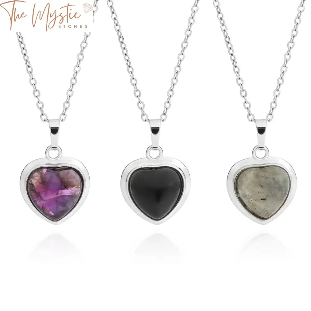 A delicate gemstone heart pendant necklace featuring vibrant amethyst stones and pink crystals.