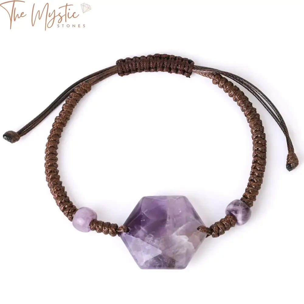 A handmade bracelet featuring faceted hexagonal amethyst crystals, intricately braided on a natural brown cord.