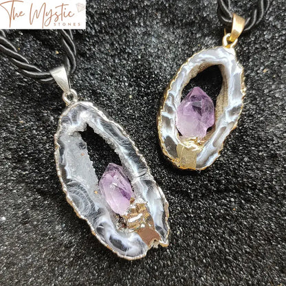 A pendant featuring a natural hollowed agate geode slice with a druzy texture, adorned with an amethyst inlay.