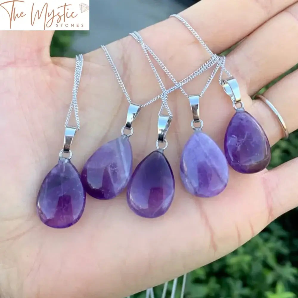 A water drop-shaped amethyst pendant featuring a vibrant purple gemstone.