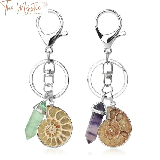 A collection of motorcycle-themed keychains featuring natural gemstones and ammonite shells.