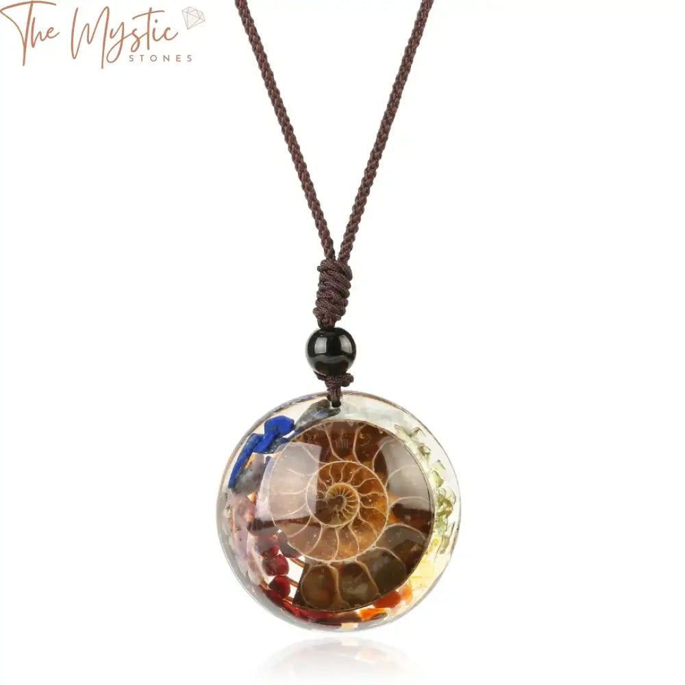 A collection of natural stone necklaces featuring ammonite pendants, cabochon chip beads, and spiral conch shell designs.