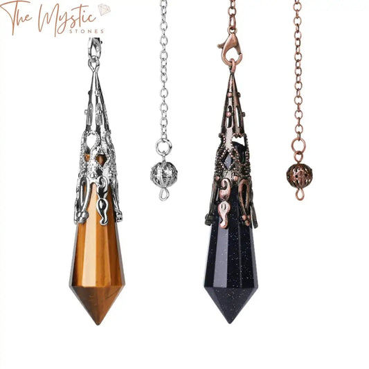 A polished pink quartz crystal pendulum hangs elegantly from an antique-style, intricately designed metal chain.