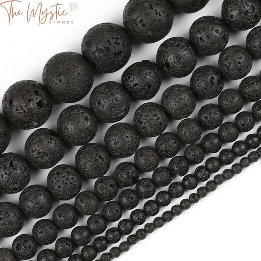 A collection of round, black lava beads in various sizes, ranging from 4mm to 14mm.