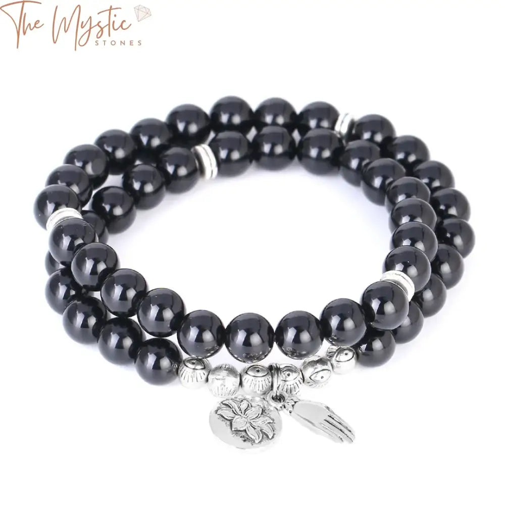 A double-layered bracelet featuring smooth, round 8mm black obsidian beads.