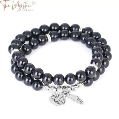 A double-layered bracelet featuring smooth, round 8mm black obsidian beads.