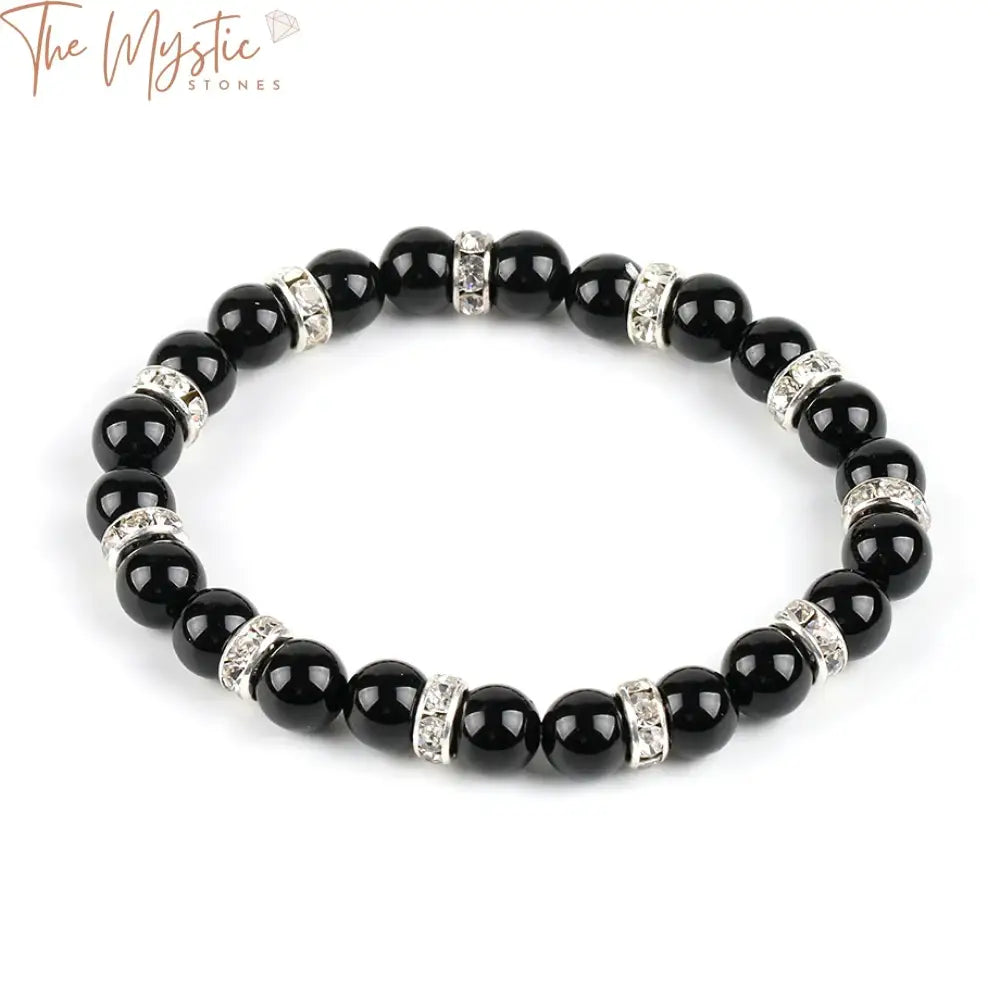 A close-up image of a jewelry piece featuring a strand of 8mm natural round black onyx agate beads.