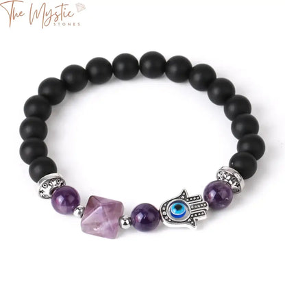 A stylish bracelet featuring a series of smooth black onyx beads interspersed with glossy agate stones.