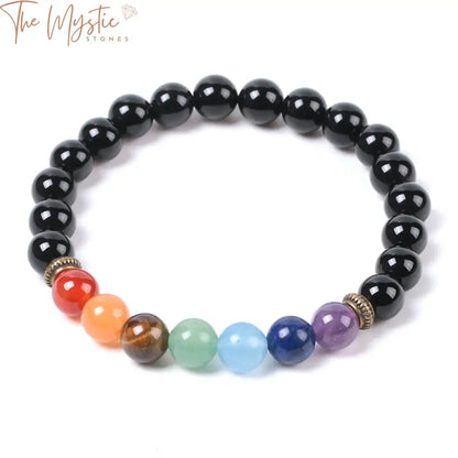 A natural stone bracelet featuring smooth, round black onyx beads.