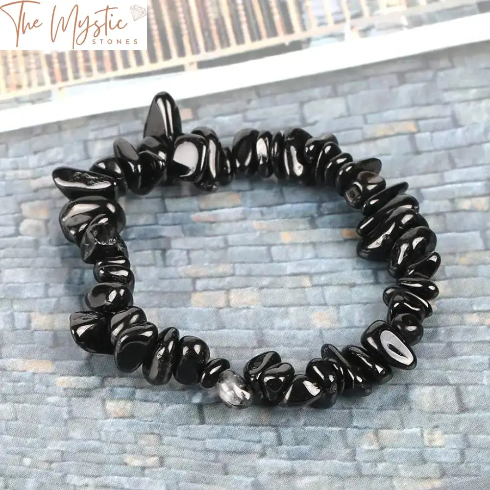 A collection of Black Tourmaline bracelets featuring chip bead designs.