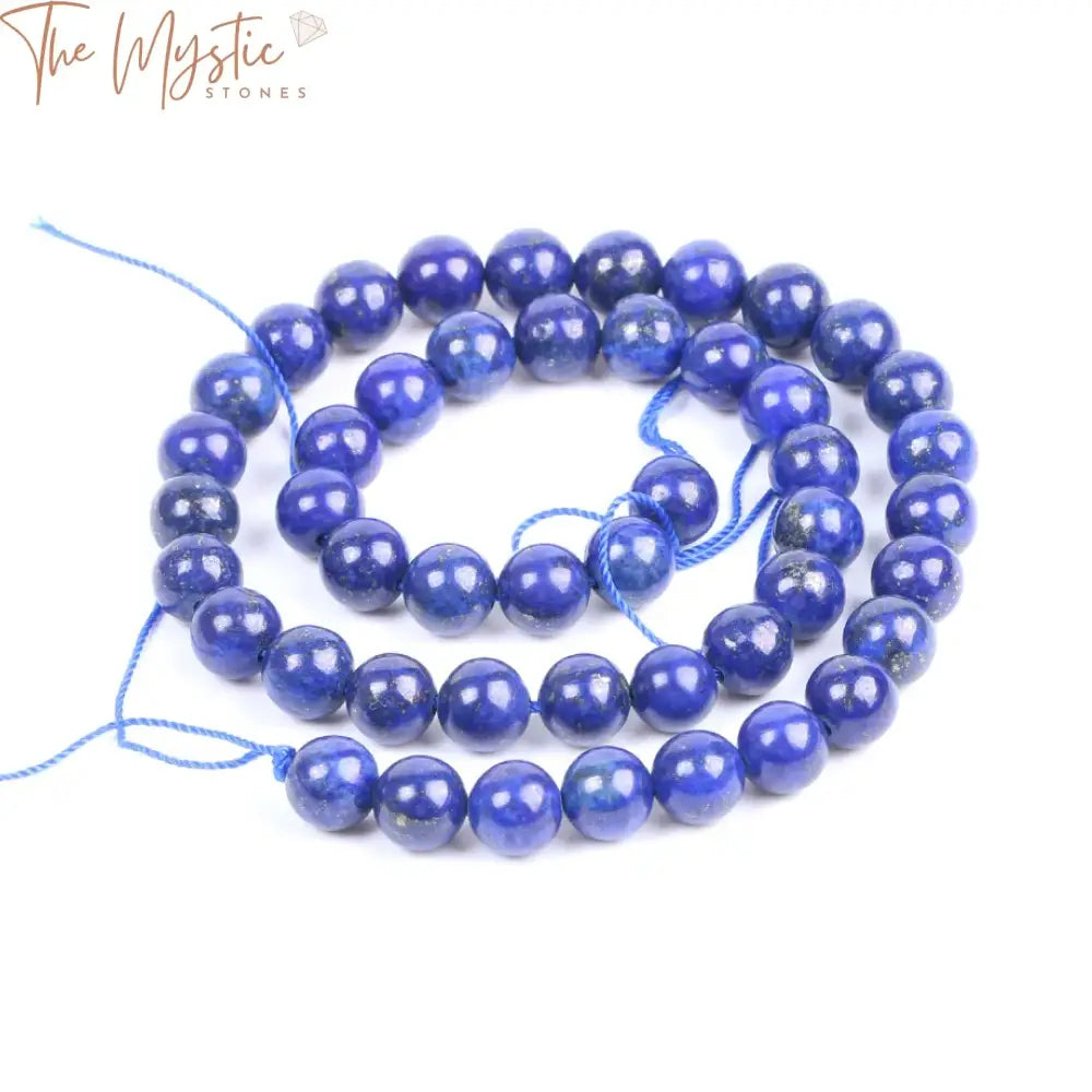 A strand of round, blue Lapis Lazuli beads, each measuring 8mm in diameter, arranged closely together.