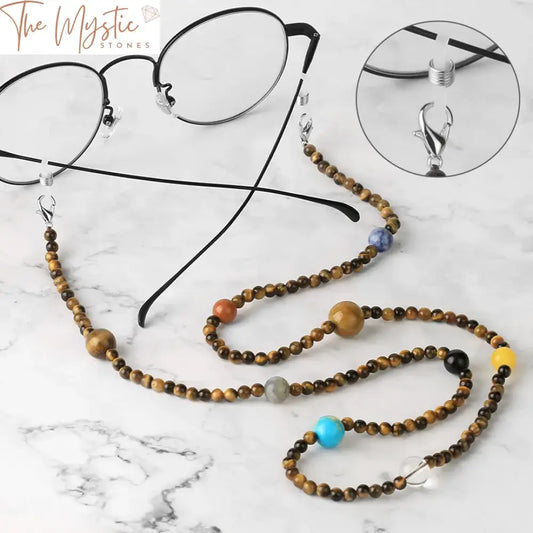 A colorful and eclectic beaded eyeglasses chain displayed elegantly, featuring a mix of vibrant beads and small charms.