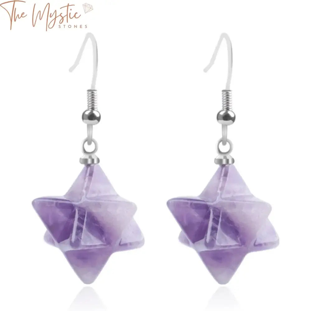 A pair of bohemian style earrings featuring Merkabah star-shaped gemstones.