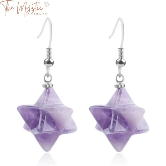 A pair of bohemian style earrings featuring Merkabah star-shaped gemstones.