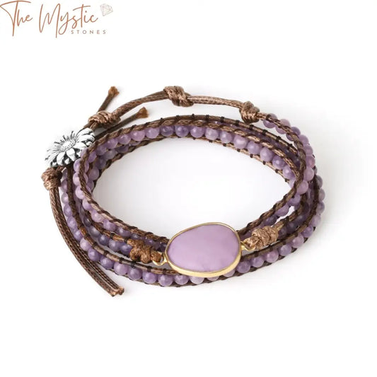 A braided bracelet featuring natural stone beads in earthy tones, intricately wrapped on a string.