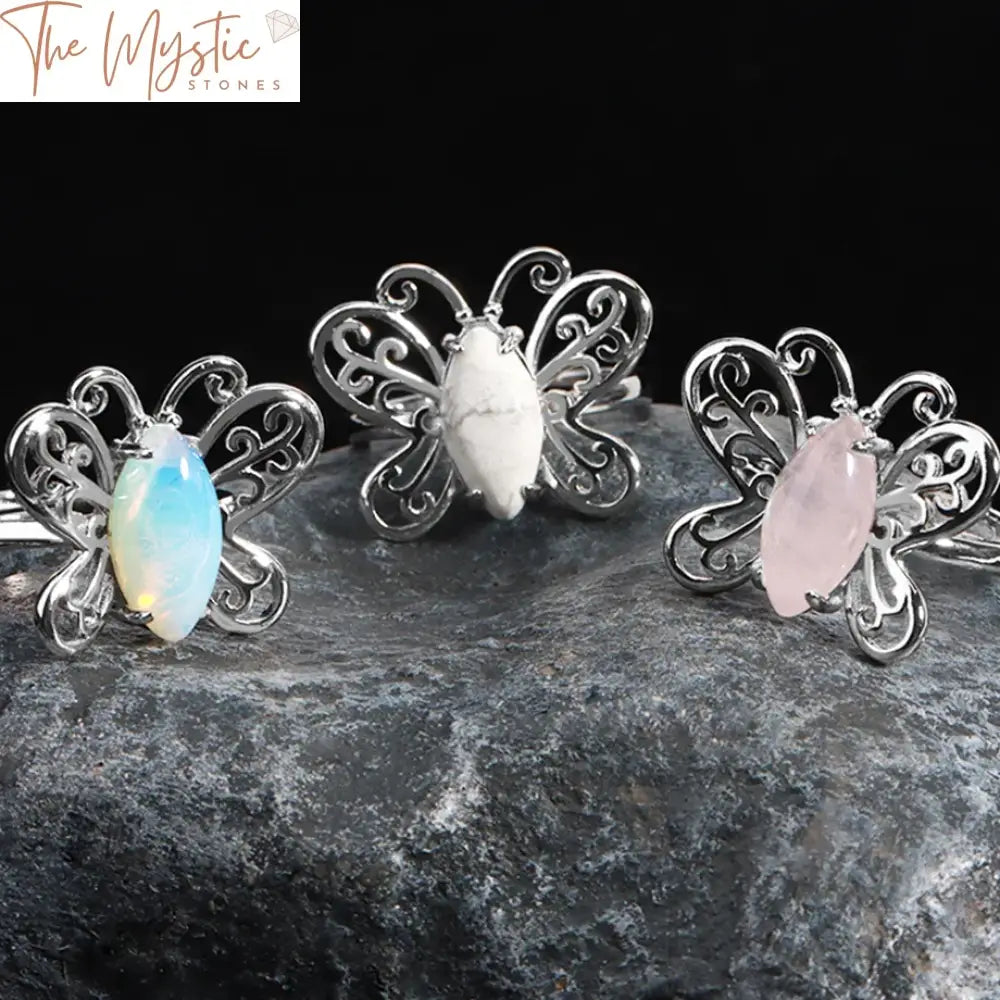 A ring featuring a unique butterfly shape with a natural stone design.