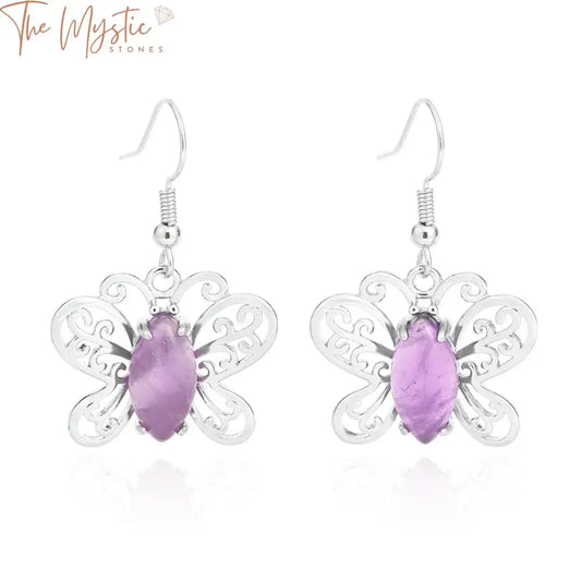 A pair of trendy butterfly pendant earrings featuring a combination of pink quartz and tiger eye crystal stones.