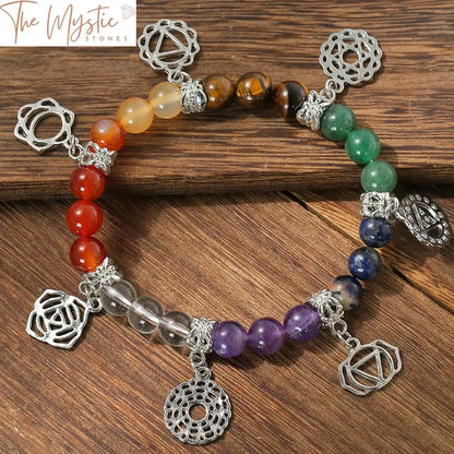 A colorful yoga bracelet made of natural stone beads represents the 7 chakras.