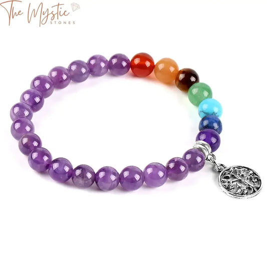 A bracelet featuring 8mm natural purple gemstone beads arranged in a stack includes a variety of colorful 7 chakra stones.