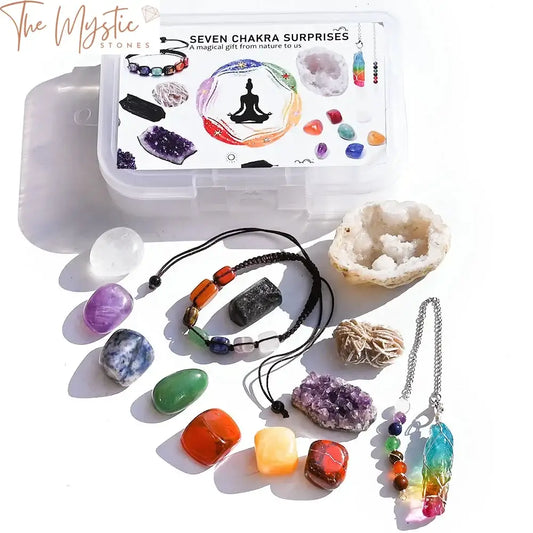 A set of healing crystals is displayed with seven chakra tumbled stones arranged in a row, showcasing vibrant colors.