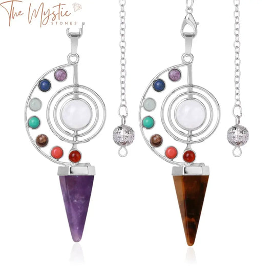 A sleek cone-shaped pendant made from natural stone, featuring vibrant colors representing the seven chakras.