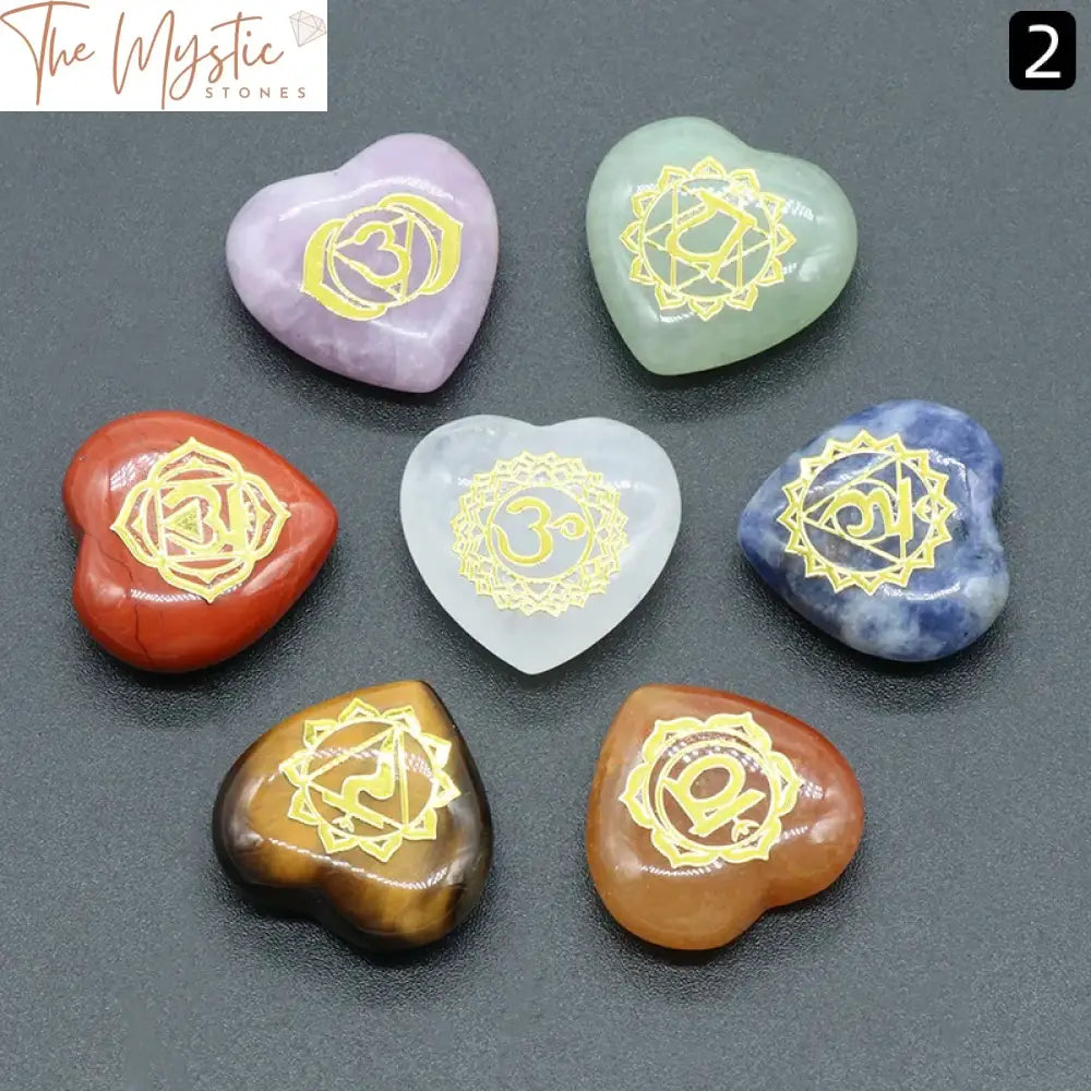 A set of seven heart-shaped stones, each in a different color, representing the seven chakras.