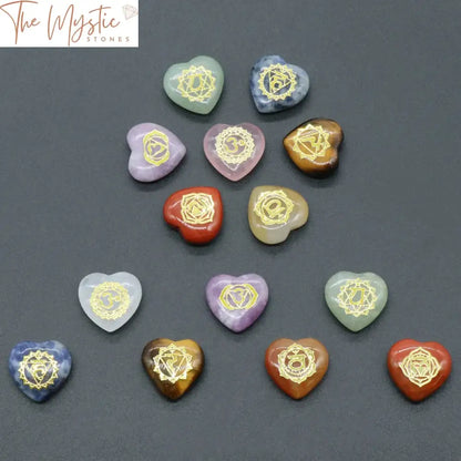 A set of seven heart-shaped stones, each in a different color, representing the seven chakras.