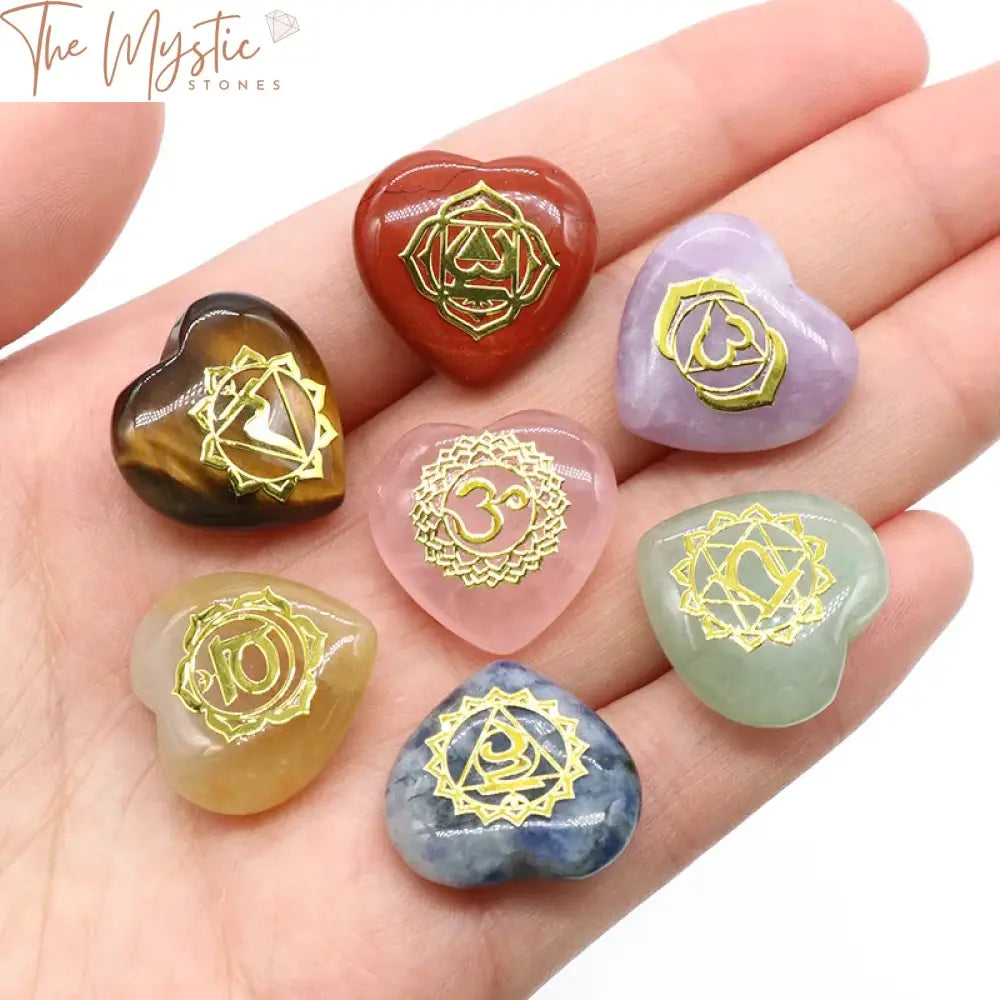 A set of seven heart-shaped stones, each in a different color, representing the seven chakras.