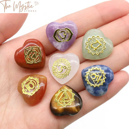 A set of seven heart-shaped stones, each in a different color, representing the seven chakras.