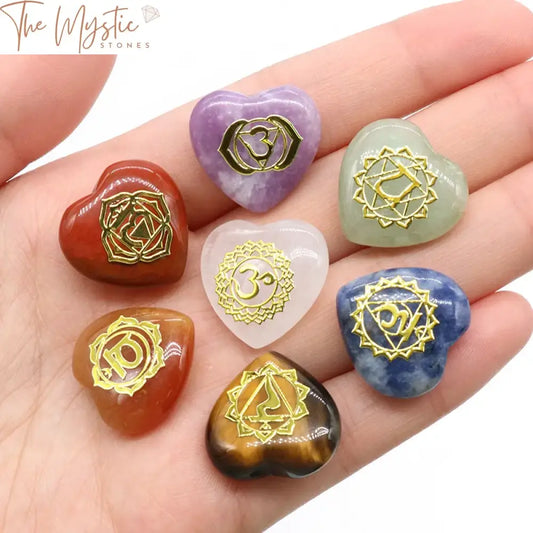 A set of seven heart-shaped stones, each in a different color, representing the seven chakras.