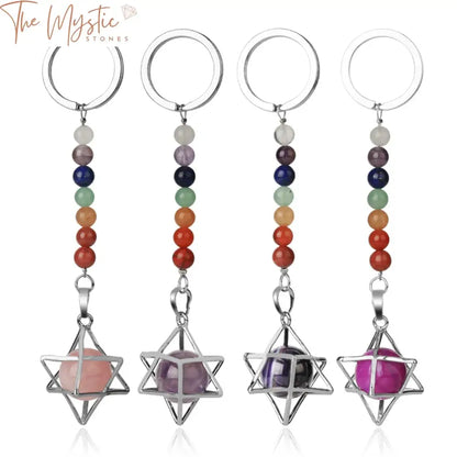 A keychain featuring a natural stones design, with a chakra key ring and a Merkaba locket pendant.