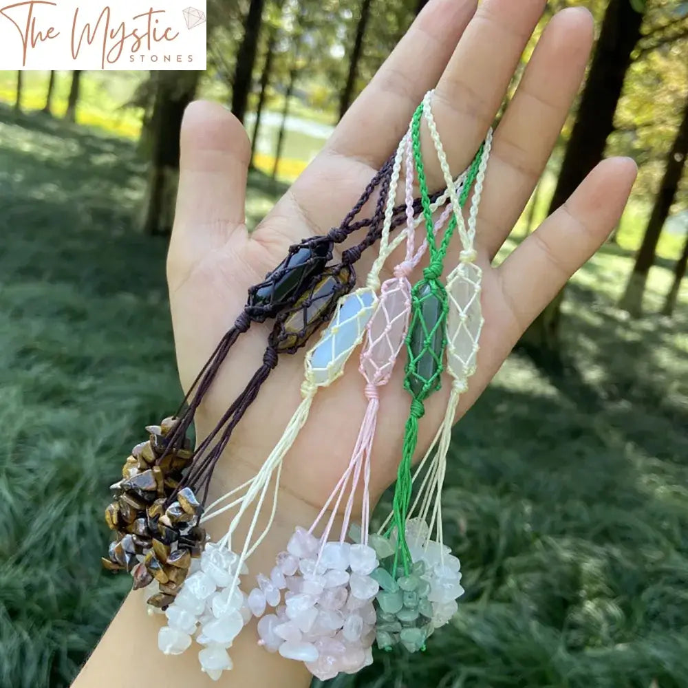 A decorative car hanging ornament featuring a double-pointed natural healing crystal with pink rose quartz at its center.