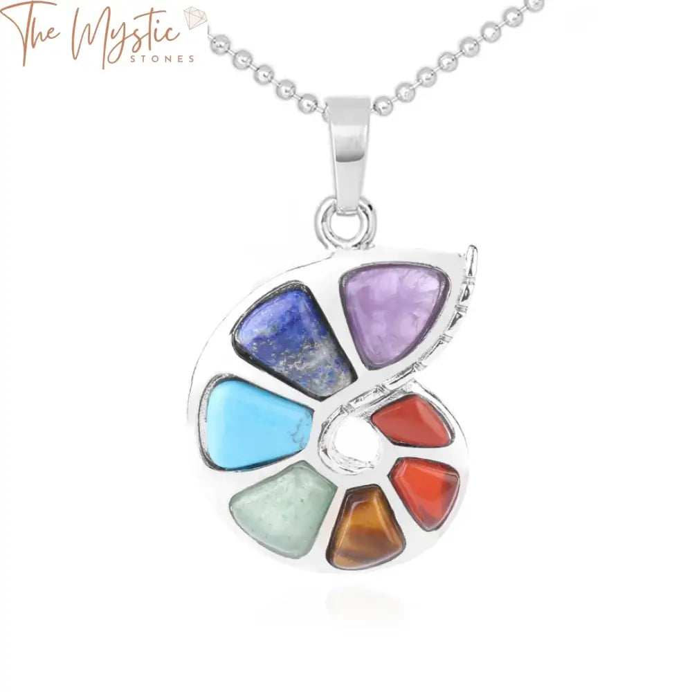 A spiral-shaped pendant featuring natural stones representing the 7 chakras, each stone a different color.