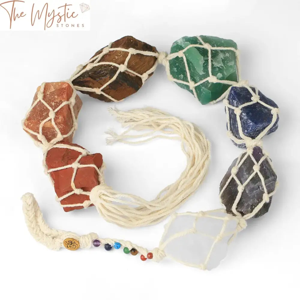 A hanging decoration featuring a collection of irregularly shaped natural stones, each representing one of the 7 chakras.