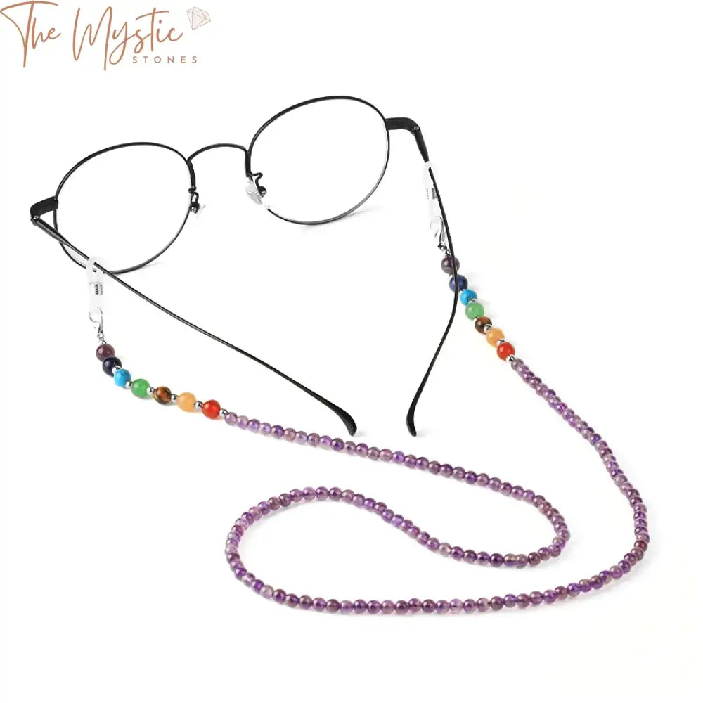 A colorful eyeglasses chain made from natural stone beads arranged in a sequence representing the seven chakras.