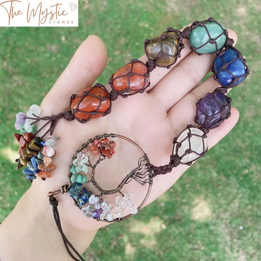 A handmade car hanging ornament featuring a Tree of Life design crafted from 7 chakra stones.